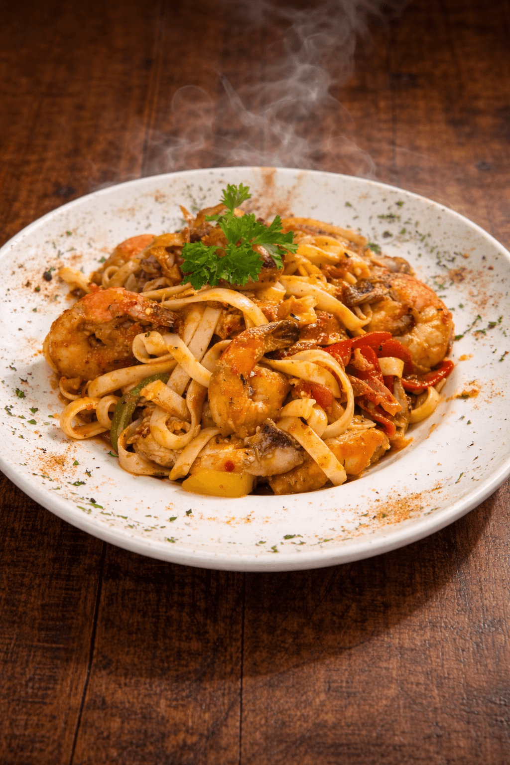MOV Cajun Pasta with spicy Italian sausage, chicken, shrimp, onions, peppers, cajun spice over fettuccini